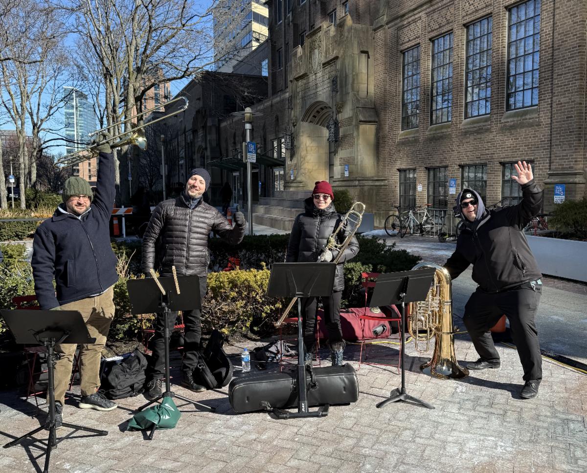 musicians pose with their instruments at shapiro plaza