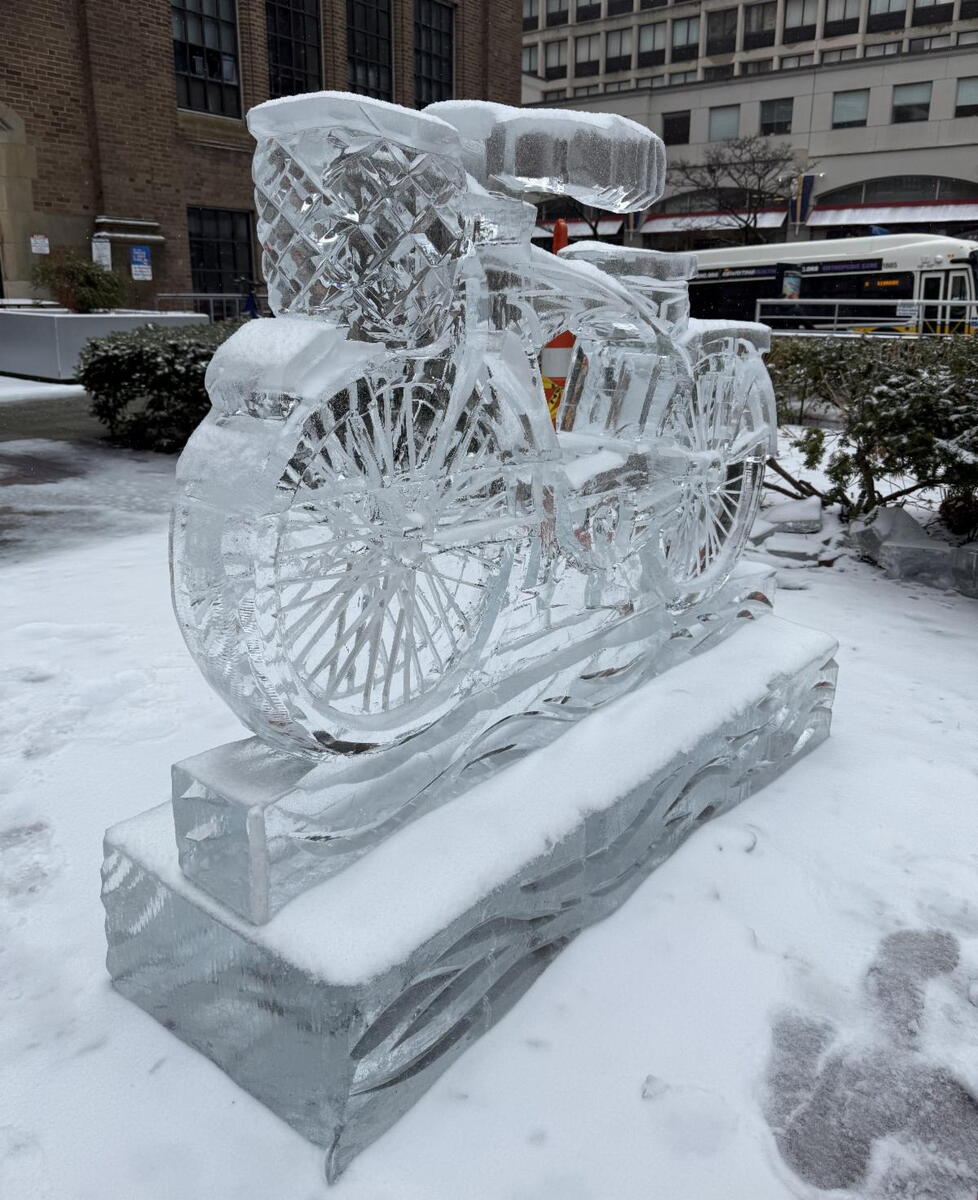 ice sculpture of a bike covered in snow