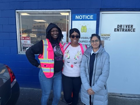 wedriveu operators stand next to Longwood Collective operations team member