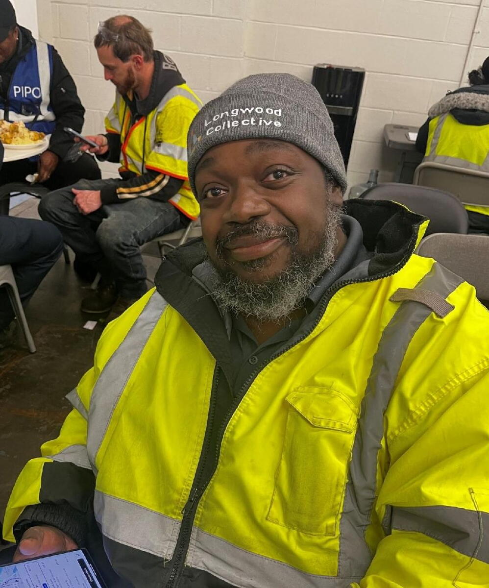 M2 driver barry poses with Longwood Collective beanie